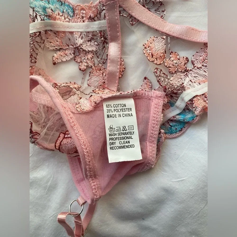 new, 2 piece bra and thong set made of thin tulle and embroidery